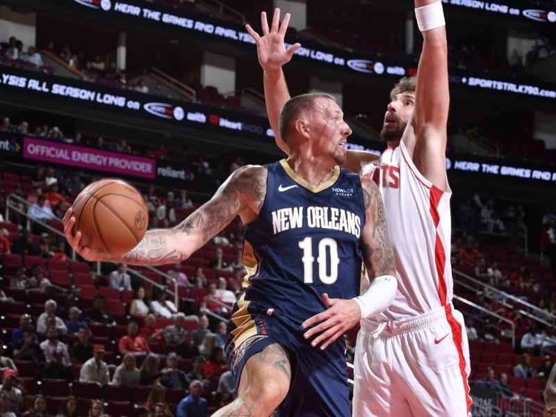 HOUSTON, TX - OCTOBER 15: Daniel Theis #10 of the New Orleans Pelicans passes the ball during the game against the Houston Rockets during a NBA preseason game on October 15, 2024 at the Toyota Center in Houston, Texas. NOTE TO USER: User expressly acknowledges and agrees that, by downloading and or using this photograph, User is consenting to the terms and conditions of the Getty Images License Agreement. Mandatory Copyright Notice: Copyright 2024 NBAE (Photo by Logan Riely/NBAE via Getty Images)