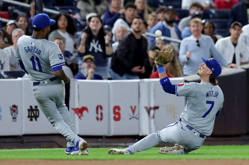 Sep 9, 2024; Bronx, New York, USA; Kansas City Royals shortstop Bobby Witt Jr. (7) slides to catch a pop fly by New York Yankees first baseman Anthony Rizzo (not pictured) during the seventh inning at Yankee Stadium. Mandatory Credit: Brad Penner-Imagn Images