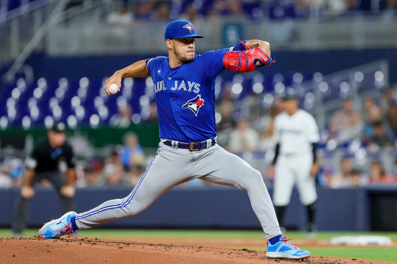 Jun 19, 2023; Miami, Florida, USA; Toronto Blue Jays starting pitcher Jose Berrios (17) delivers a pitch against the Miami Marlins during the first inning at loanDepot Park. Mandatory Credit: Sam Navarro-USA TODAY Sports