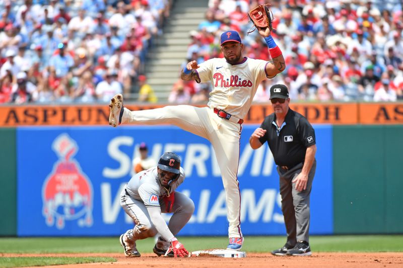 Jul 28, 2024; Philadelphia, Pennsylvania, USA; Philadelphia Phillies shortstop Edmundo Sosa (33) and Cleveland Guardians third base Angel Martínez (1) watch completion of double play at first base during the first inning at Citizens Bank Park. Mandatory Credit: Eric Hartline-USA TODAY Sports