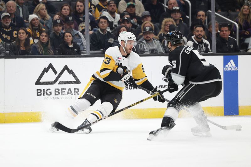 Nov 9, 2023; Los Angeles, California, USA; Pittsburgh Penguins left wing Radim Zohorna (63) makes a play against Los Angeles Kings defensemen Andreas Englund (5) during the first period at Crypto.com Arena. Mandatory Credit: Yannick Peterhans-USA TODAY Sports