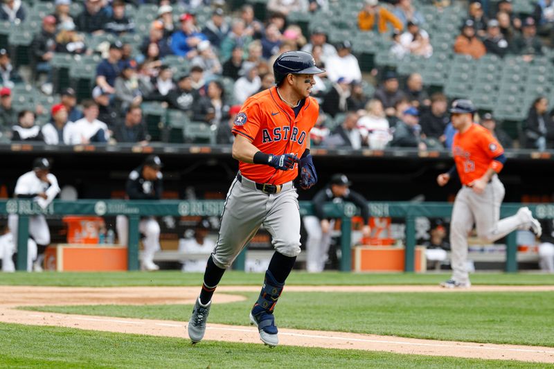May 4, 2025; Chicago, Illinois, USA; Houston Astros third baseman Mauricio Dubón (14) runs after hitting a two-run single against the Chicago White Sox during the second inning at Rate Field. Mandatory Credit: Kamil Krzaczynski-Imagn Images