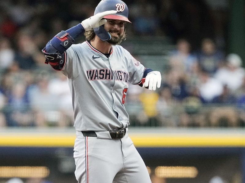 Jul 12, 2024; Milwaukee, Wisconsin, USA;  Washington Nationals designated hitter Jesse Winker (6) reacts after hitting a double during the first inning against the Milwaukee Brewers at American Family Field. Mandatory Credit: Jeff Hanisch-USA TODAY Sports