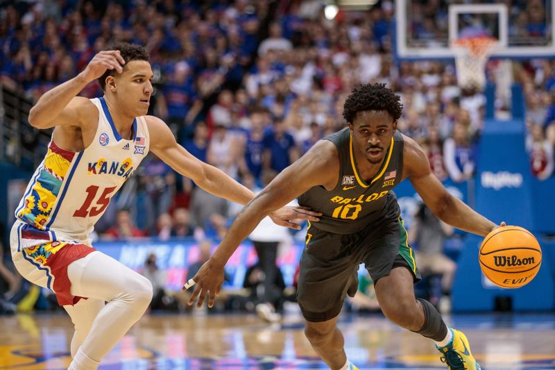 Feb 18, 2023; Lawrence, Kansas, USA; Baylor Bears guard Adam Flagler (10) drives around Kansas Jayhawks guard Kevin McCullar Jr. (15) during the first half at Allen Fieldhouse. Mandatory Credit: William Purnell-USA TODAY Sports