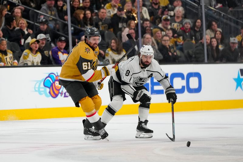 Dec 28, 2023; Las Vegas, Nevada, USA; Vegas Golden Knights right wing Mark Stone (61) and Los Angeles Kings defenseman Drew Doughty (8) skate for the puck during the third period at T-Mobile Arena. Mandatory Credit: Lucas Peltier-USA TODAY Sports