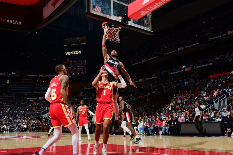 ATLANTA, GA - MARCH 3: Shaedon Sharpe #17 of the Portland Trail Blazers dunks the ball during the game against the Atlanta Hawks on March 3, 2023 at State Farm Arena in Atlanta, Georgia.  NOTE TO USER: User expressly acknowledges and agrees that, by downloading and/or using this Photograph, user is consenting to the terms and conditions of the Getty Images License Agreement. Mandatory Copyright Notice: Copyright 2023 NBAE (Photo by Scott Cunningham/NBAE via Getty Images)