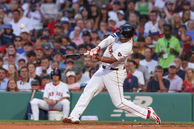 Jun 24, 2024; Boston, Massachusetts, USA; Boston Red Sox third baseman Rafael Devers (11) hits a two run home run during the fourth inning against the Toronto Blue Jays at Fenway Park. Mandatory Credit: Paul Rutherford-USA TODAY Sports