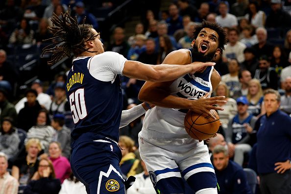 MINNEAPOLIS, MINNESOTA - NOVEMBER 01: Karl-Anthony Towns #32 of the Minnesota Timberwolves goes up for a shot while Aaron Gordon #50 of the Denver Nuggets defends in the second quarter at Target Center on November 01, 2023 in Minneapolis, Minnesota. The Timberwolves defeated the Nuggets 110-89. NOTE TO USER: User expressly acknowledges and agrees that, by downloading and or using this photograph, User is consenting to the terms and conditions of the Getty Images License Agreement. (Photo by David Berding/Getty Images)