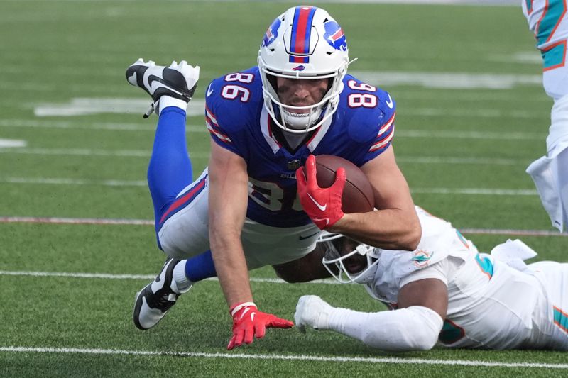 Buffalo Bills tight end Dalton Kincaid (86) dives for a first down during the second half of an NFL football game against the Miami Dolphins, Sunday, Nov. 3, 2024, in Orchard Park, N.Y. (AP Photo/Gene Puskar)