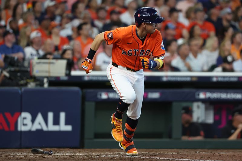 Oct 2, 2024; Houston, Texas, USA; Houston Astros outfielder Mauricio Dubon (14) hits a single against the Detroit Tigers during the fifth inning of game two of the Wildcard round for the 2024 MLB Playoffs at Minute Maid Park. Mandatory Credit: Thomas Shea-Imagn Images