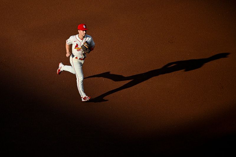 Aug 5, 2023; St. Louis, Missouri, USA;  St. Louis Cardinals shortstop Tommy Edman (19) runs off the field after the top half of the first inning against the Colorado Rockies at Busch Stadium. Mandatory Credit: Jeff Curry-USA TODAY Sports