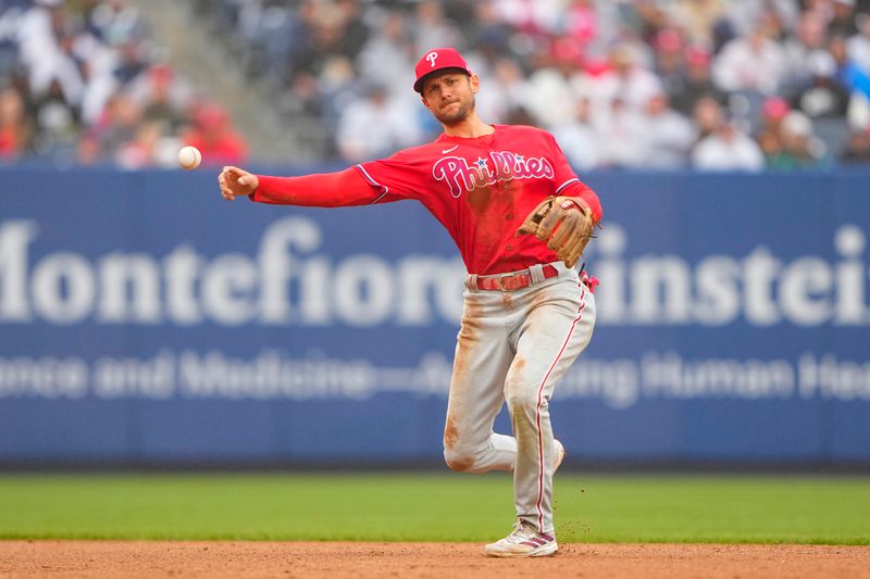 Apr 5, 2023; Bronx, New York, USA; Philadelphia Phillies shortstop Trea Turner (7) throws out New York Yankees second baseman DJ LeMahieu (26) (not pictured) during the third inning at Yankee Stadium. Mandatory Credit: Gregory Fisher-USA TODAY Sports