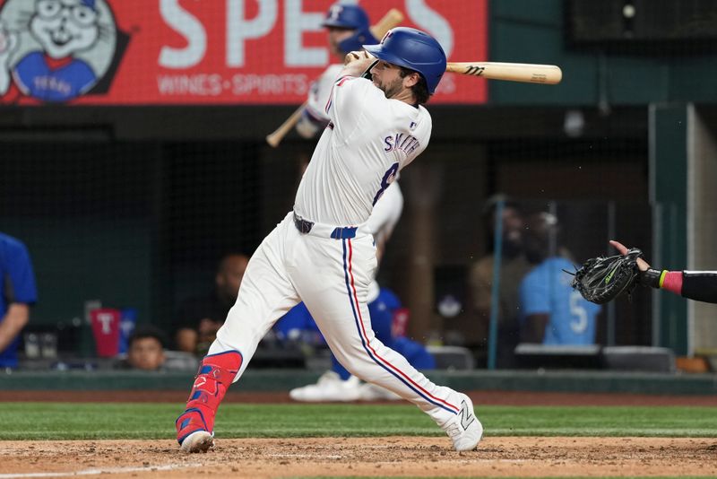 Sep 7, 2024; Arlington, Texas, USA; Texas Rangers short stop Josh Smith (8) follows through on his RBI double against the Los Angeles Angels during the seventh inning at Globe Life Field. Mandatory Credit: Jim Cowsert-Imagn Images