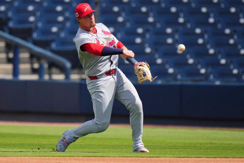 Mar 5, 2025; West Palm Beach, Florida, USA; St. Louis Cardinals second base Nolan Gorman (16) throws the ball to first base for an out against the Houston Astros during the second inning at CACTI Park of the Palm Beaches. Mandatory Credit: Rich Storry-Imagn Images