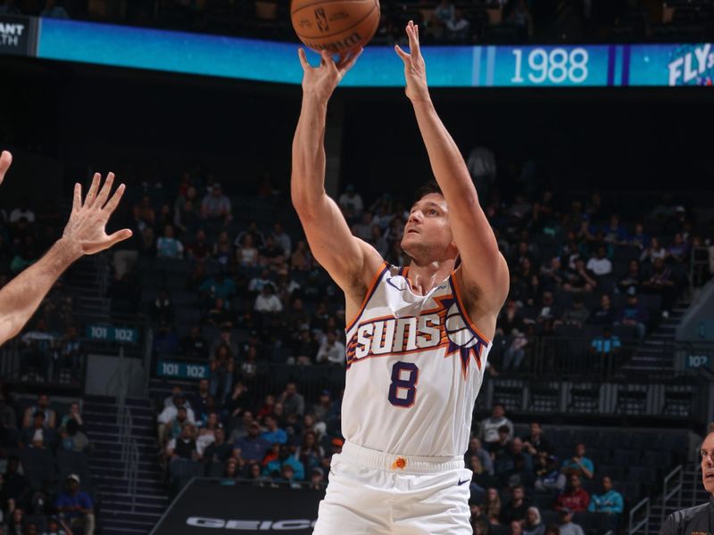 CHARLOTTE, NC - MARCH 15:  Grayson Allen #8 of the Phoenix Suns shoots a 3-point basket during the game  on March 15, 2024 at Spectrum Center in Charlotte, North Carolina. NOTE TO USER: User expressly acknowledges and agrees that, by downloading and or using this photograph, User is consenting to the terms and conditions of the Getty Images License Agreement.  Mandatory Copyright Notice:  Copyright 2024 NBAE (Photo by Kent Smith/NBAE via Getty Images)