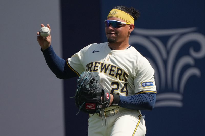 Mar 16, 2025; Phoenix, Arizona, USA; Milwaukee Brewers catcher William Contreras (24) gets ready for a game against the Cleveland Guardians at American Family Fields of Phoenix. Mandatory Credit: Rick Scuteri-Imagn Images