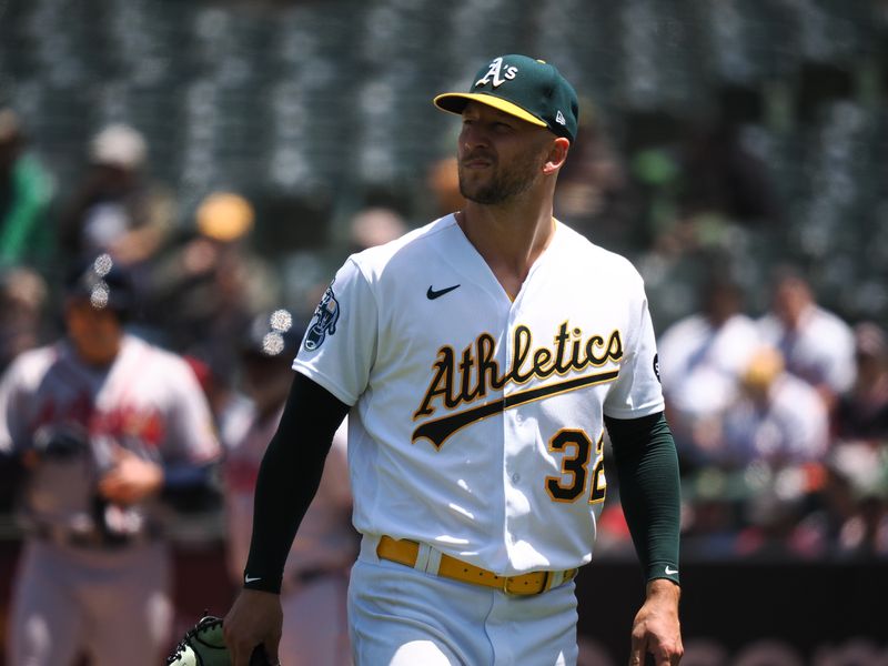 May 31, 2023; Oakland, California, USA; Oakland Athletics starting pitcher James Kaprielian (32) returns to the dugout after leaving the game during the fifth inning against the Atlanta Braves at Oakland-Alameda County Coliseum. Mandatory Credit: Kelley L Cox-USA TODAY Sports