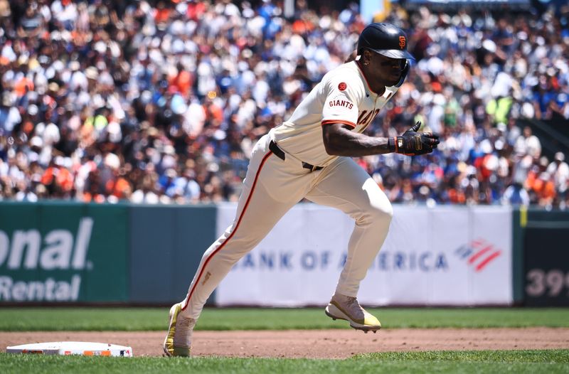 Jun 30, 2024; San Francisco, California, USA; San Francisco Giants designated hitter Jorge Soler (2) runs home after a sacrifice fly for a run against the Los Angeles Dodgers during the first inning at Oracle Park. Mandatory Credit: Kelley L Cox-USA TODAY Sports