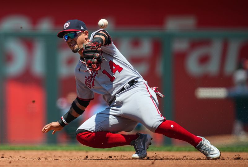 May 28, 2023; Kansas City, Missouri, USA; Washington Nationals second baseman Ildemaro Vargas (14) is unable to make the catch during the first inning against the Kansas City Royals at Kauffman Stadium. Mandatory Credit: Jay Biggerstaff-USA TODAY Sports