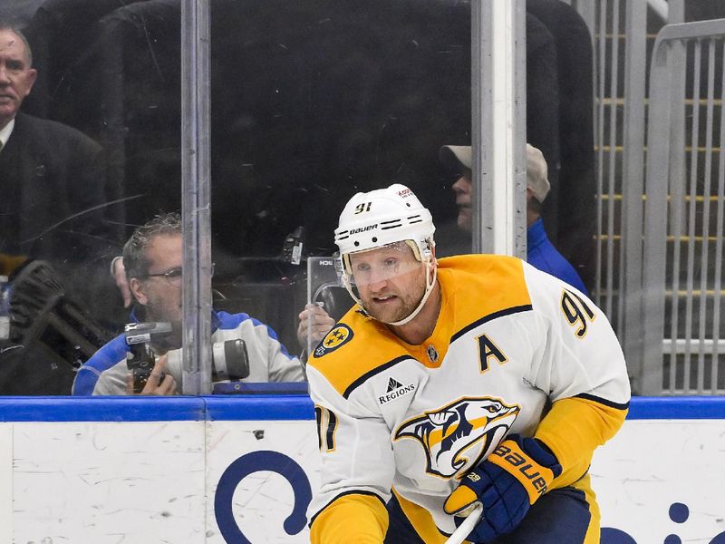 Mar 23, 2025; St. Louis, Missouri, USA;  Nashville Predators center Steven Stamkos (91) shoots against the St. Louis Blues during the third period at Enterprise Center. Mandatory Credit: Jeff Curry-Imagn Images