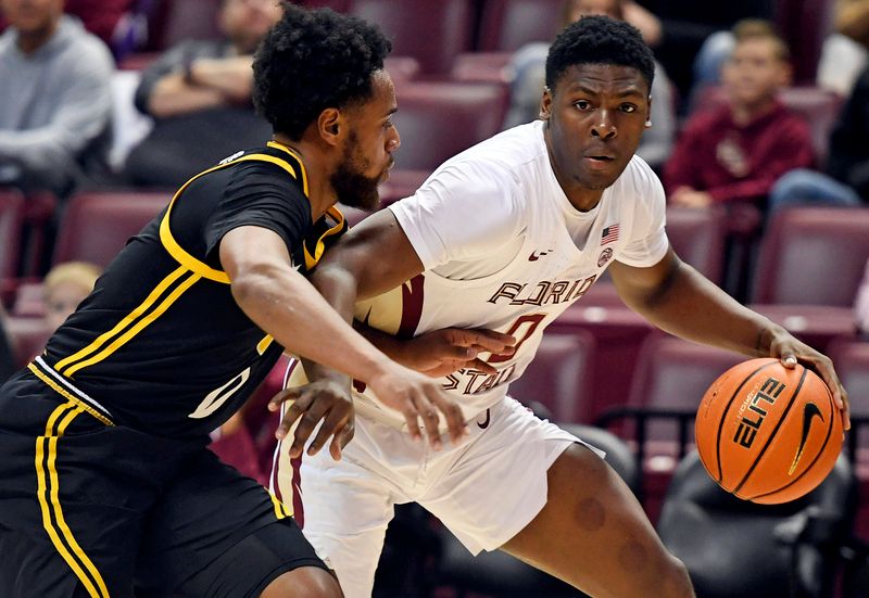 Feb 11, 2023; Tallahassee, Florida, USA; Florida State Seminoles guard Chandler Jackson (0) works the ball around Pittsburgh Panthers guard Nelly Cummings (0) during the first half at Donald L. Tucker Center. Mandatory Credit: Melina Myers-USA TODAY Sports