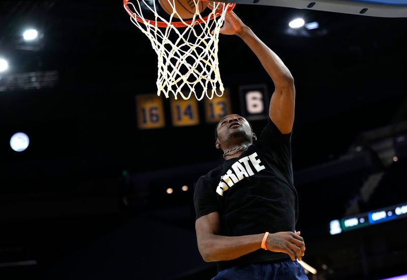 SAN FRANCISCO, CALIFORNIA - FEBRUARY 23: Jonathan Kuminga #00 of the Golden State Warriors warms up prior to the start of an NBA basketball game against the Charlotte Hornets at Chase Center on February 23, 2024 in San Francisco, California. NOTE TO USER: User expressly acknowledges and agrees that, by downloading and or using this photograph, User is consenting to the terms and conditions of the Getty Images License Agreement. (Photo by Thearon W. Henderson/Getty Images)