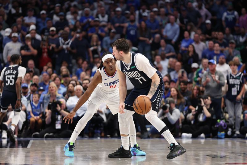 DALLAS, TX - APRIL 28: Luka Doncic #77 of the Dallas Mavericks dribbles the ball during the game against the LA Clippers during Round 1 Game 4 of the 2024 NBA Playoffs on April 28, 2024 at the American Airlines Center in Dallas, Texas. NOTE TO USER: User expressly acknowledges and agrees that, by downloading and or using this photograph, User is consenting to the terms and conditions of the Getty Images License Agreement. Mandatory Copyright Notice: Copyright 2024 NBAE (Photo by Tim Heitman/NBAE via Getty Images)