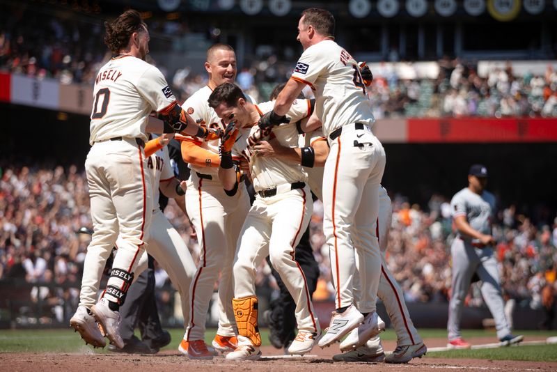Jul 14, 2024; San Francisco, California, USA; San Francisco Giants right fielder Mike Yastrzemski (center) celebrates with teammates after scoring the winning run against the Minnesota Twins during the ninth inning at Oracle Park. Mandatory Credit: D. Ross Cameron-USA TODAY Sports