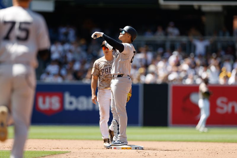 May 26, 2024; San Diego, California, USA; New York Yankees right fielder Juan Soto (22) celebrates at second base after hitting a rbi double in the sixth inning against the San Diego Padres  at Petco Park. Mandatory Credit: David Frerker-USA TODAY Sports