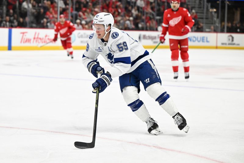 Nov 28, 2025; Detroit, Michigan, USA;  Tampa Bay Lightning center Jake Guentzel (59) skates up the ice against the Detroit Red Wings in the first period at Little Caesars Arena. Mandatory Credit: Lon Horwedel-Imagn Images