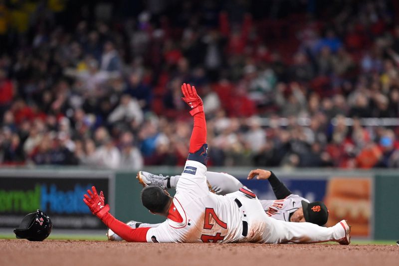 May 1, 2024; Boston, Massachusetts, USA; Boston Red Sox second baseman Enmanuel Valdez (47) is safe after sliding into second base during the fourth inning against the San Francisco Giants at Fenway Park. Mandatory Credit: Eric Canha-USA TODAY Sports