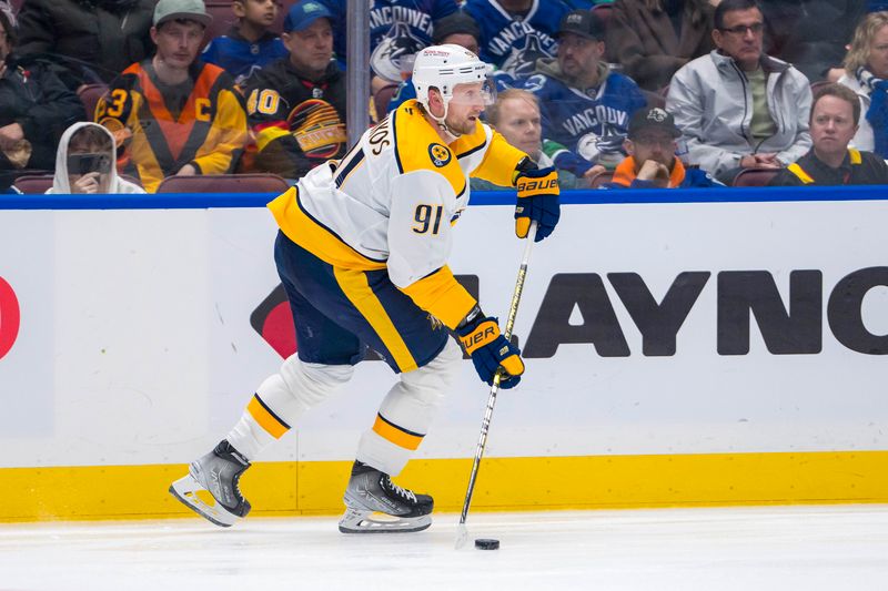 Jan 3, 2025; Vancouver, British Columbia, CAN; Nashville Predators forward Steven Stamkos (91) handles the puck against the Vancouver Canucks in the second period at Rogers Arena. Mandatory Credit: Bob Frid-Imagn Images