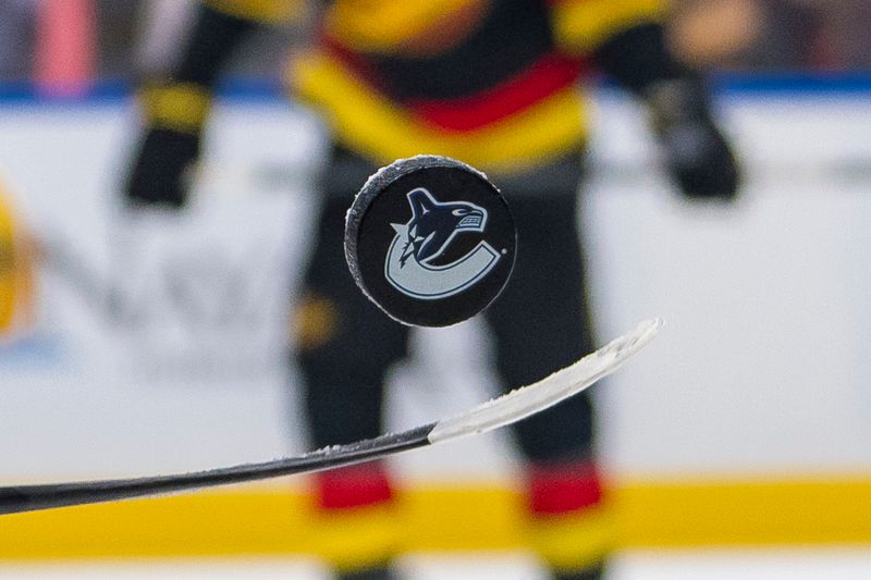 Nov 9, 2024; Vancouver, British Columbia, CAN; Vancouver Canucks forward Kiefer Sherwood (44) handles the puck during warm up prior to a game against the Edmonton Oilers at Rogers Arena. Mandatory Credit: Bob Frid-Imagn Images