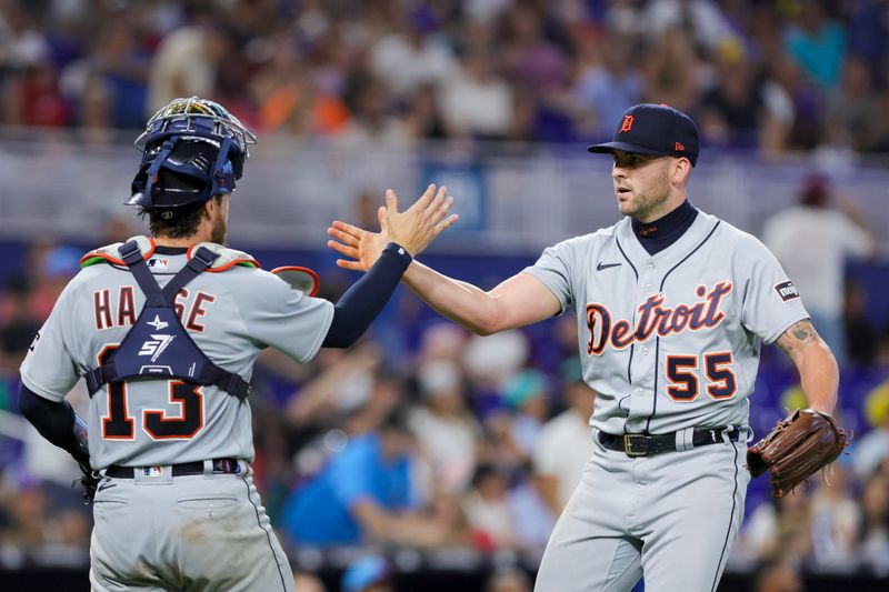 Jul 29, 2023; Miami, Florida, USA; Detroit Tigers relief pitcher Alex Lange (55) celebrates with catcher Eric Haase (13) after winning the game against the Miami Marlins at loanDepot Park. Mandatory Credit: Sam Navarro-USA TODAY Sports