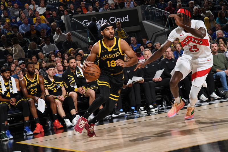 SAN FRANCISCO, CA - JANUARY 7: Jerome Robinson #18 of the Golden State Warriors  dribbles the ball during the game against the Toronto Raptors on January 7, 2024 at Chase Center in San Francisco, California. NOTE TO USER: User expressly acknowledges and agrees that, by downloading and or using this photograph, user is consenting to the terms and conditions of Getty Images License Agreement. Mandatory Copyright Notice: Copyright 2024 NBAE (Photo by Noah Graham/NBAE via Getty Images)