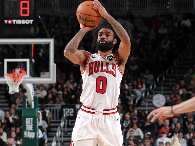 MILWAUKEE, WI - NOVEMBER 20: Coby White #0 of the Chicago Bulls three point basket during the game against the Milwaukee Bucks on November 20, 2024 at the Fiserv Forum Center in Milwaukee, Wisconsin. NOTE TO USER: User expressly acknowledges and agrees that, by downloading and or using this Photograph, user is consenting to the terms and conditions of the Getty Images License Agreement. Mandatory Copyright Notice: Copyright 2024 NBAE (Photo by Gary Dineen/NBAE via Getty Images).