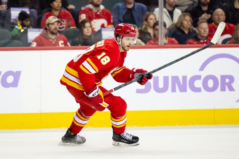 Nov 22, 2025; Calgary, Alberta, CAN; Calgary Flames center John Beecher (18) skates against the Dallas Stars during the first period at Scotiabank Saddledome. Mandatory Credit: Brett Holmes-Imagn Images