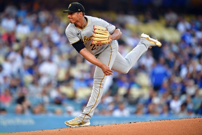 Jul 6, 2023; Los Angeles, California, USA; Pittsburgh Pirates starting pitcher Johan Oviedo (24) throws against the Los Angeles Dodgers during the first inning at Dodger Stadium. Mandatory Credit: Gary A. Vasquez-USA TODAY Sports
