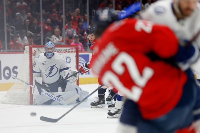 Mar 1, 2025; Washington, District of Columbia, USA; Tampa Bay Lightning goaltender Andrei Vasilevskiy (88) makes a save on Washington Capitals right wing Brandon Duhaime (22) in the first period at Capital One Arena. Mandatory Credit: Geoff Burke-Imagn Images