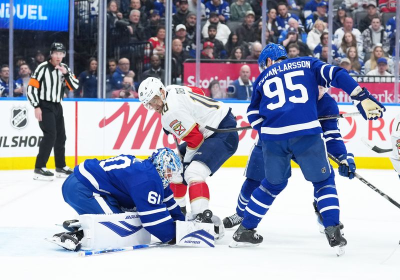 Jan 6, 2026; Toronto, Ontario, CAN; Florida Panthers left wing A.J. Greer (10) battles in front of Toronto Maple Leafs goaltender Joseph Woll (60) during the second period at Scotiabank Arena. Mandatory Credit: Nick Turchiaro-Imagn Images