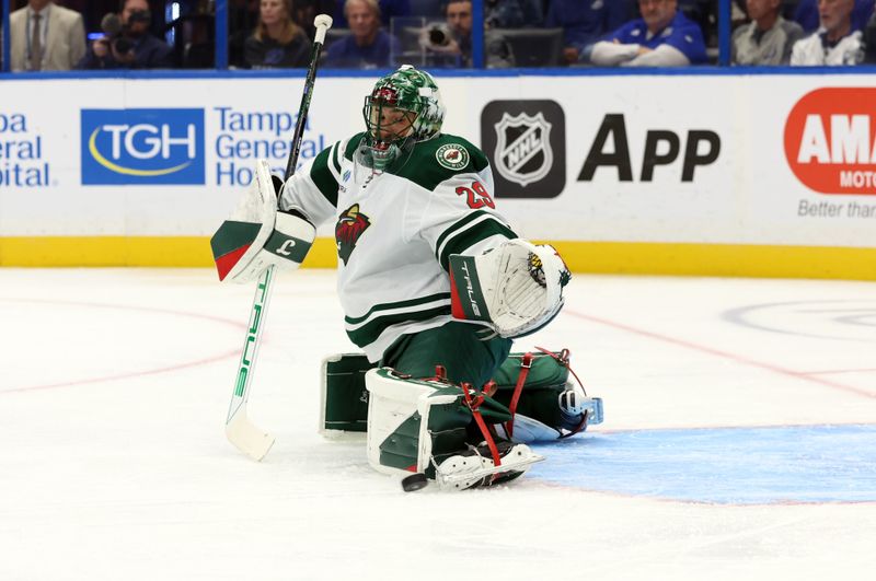 Oct 24, 2024; Tampa, Florida, USA; Minnesota Wild goaltender Marc-Andre Fleury (29) make a save against the Tampa Bay Lightning during the first period at Amalie Arena. Mandatory Credit: Kim Klement Neitzel-Imagn Images