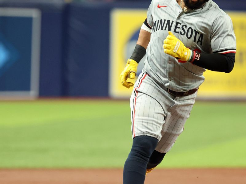 Sep 3, 2024; St. Petersburg, Florida, USA;  Minnesota Twins first base Carlos Santana (30) runs around the bases after hitting a home run against the Tampa Bay Rays during the second inning at Tropicana Field. Mandatory Credit: Kim Klement Neitzel-Imagn Images