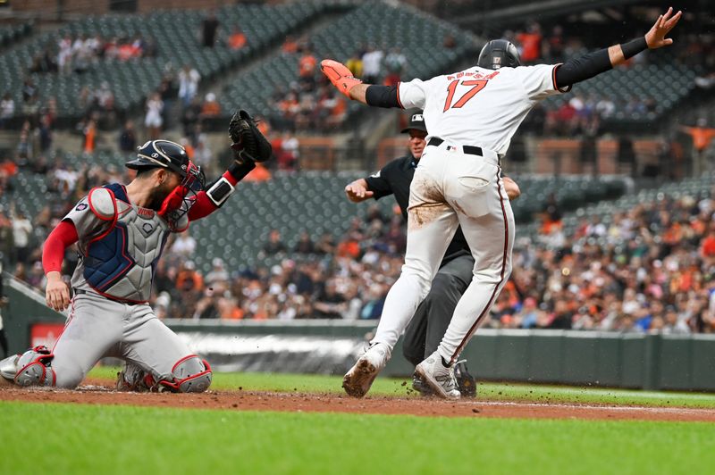 May 29, 2024; Baltimore, Maryland, USA; Baltimore Orioles outfielder Colton Cowser (17)   reacts as home plate umpire Scott Barry (87) signals  safe as Boston Red Sox catcher Connor Wong (12) looks on during the second inning  at Oriole Park at Camden Yards. Mandatory Credit: Tommy Gilligan-USA TODAY Sports