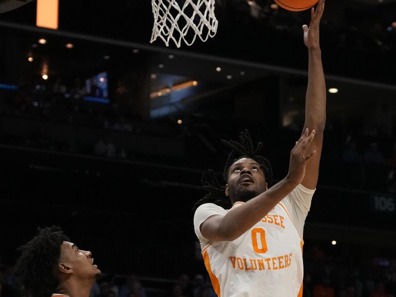 March 23, 2024, Charlotte, NC, USA; Tennessee Volunteers forward Jonas Aidoo (0) shoots against the Texas Longhorns in the second round of the 2024 NCAA Tournament at the Spectrum Center. Mandatory Credit: Jim Dedmon-USA TODAY Sports