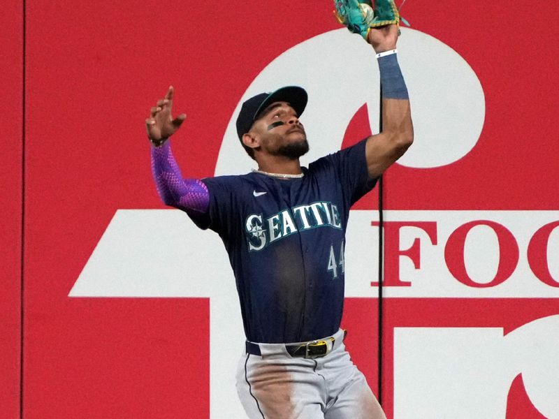 Jun 9, 2025; Phoenix, Arizona, USA; Seattle Mariners outfielder Julio Rodríguez (44) makes the jumping catch for an out against the Arizona Diamondbacks in the first inning at Chase Field. Mandatory Credit: Rick Scuteri-Imagn Images
