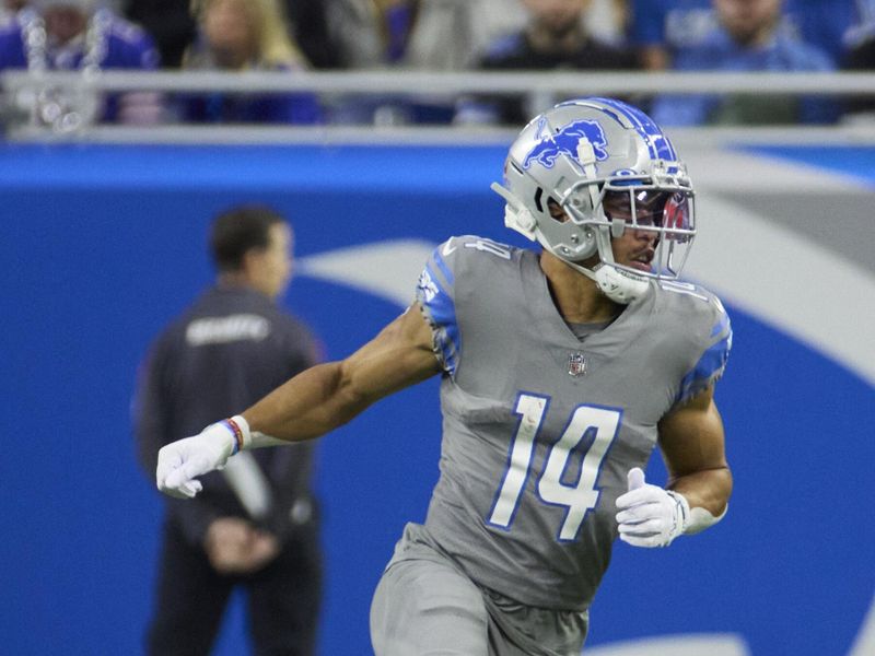 Detroit Lions wide receiver Amon-Ra St. Brown (14)runs a route against the Buffalo Bills during an NFL football game, Thursday, Nov. 24, 2022, in Detroit. (AP Photo/Rick Osentoski)