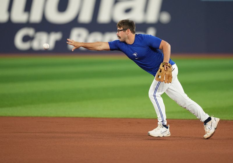 Aug 30, 2023; Toronto, Ontario, CAN; Toronto Blue Jays second baseman Davis Schneider (36) throws a ball to second base during batting practice before a game against the Washington Nationals at Rogers Centre. Mandatory Credit: Nick Turchiaro-USA TODAY Sports