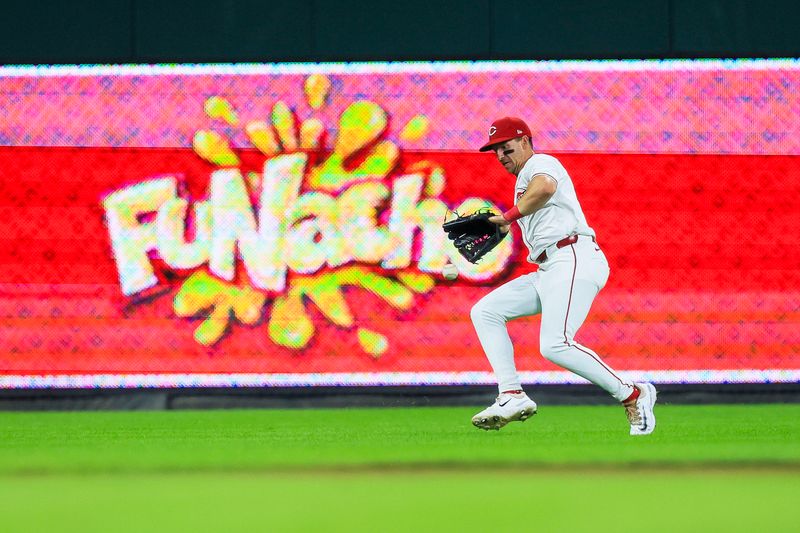 Sep 17, 2024; Cincinnati, Ohio, USA; Cincinnati Reds outfielder Spencer Steer (7) fields the ball hit by Atlanta Braves outfielder Michael Harris II (not pictured) in the seventh inning at Great American Ball Park. Mandatory Credit: Katie Stratman-Imagn Images