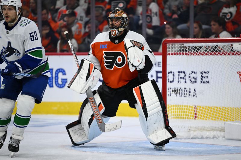 Oct 19, 2024; Philadelphia, Pennsylvania, USA; Philadelphia Flyers goalie Samuel Ersson (33) defends the net against the Vancouver Canucks in the third period at Wells Fargo Center. Mandatory Credit: Kyle Ross-Imagn Images