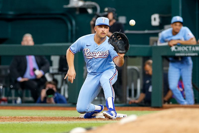 Apr 2, 2023; Arlington, Texas, USA; Texas Rangers first baseman Nathaniel Lowe (30) fields a throw during the eighth inning against the Philadelphia Phillies at Globe Life Field. Mandatory Credit: Andrew Dieb-USA TODAY Sports